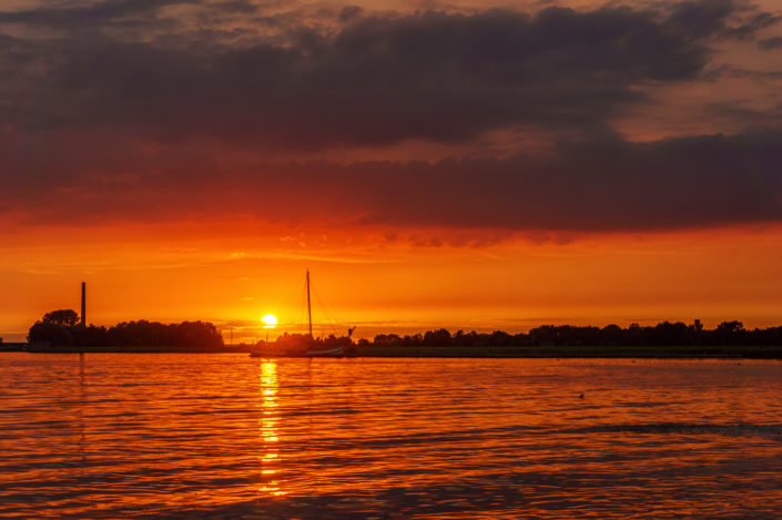 sunset lemmer and a boat